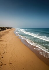 An expansive coastal scene captured looking along the vast stretch of golden sand and shimmering ocean towards the distant horizon ,destination ,sand ,natural beauty