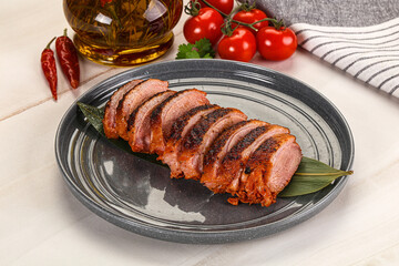 Sliced duck breast baked with cherry