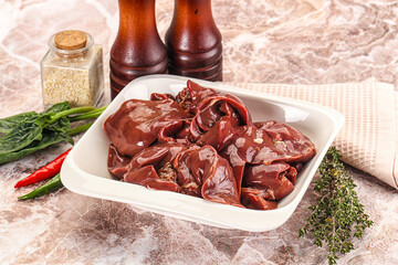 Raw uncokked chicken liver in the bowl