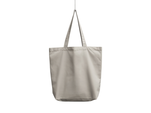 Beige cotton tote bag hanging isolated on transparent background, a versatile and ecofriendly option for shopping, carrying books, or everyday use, promoting sustainability