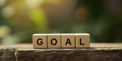 Wooden Blocks Spelling Goal Set Against Blurred Background