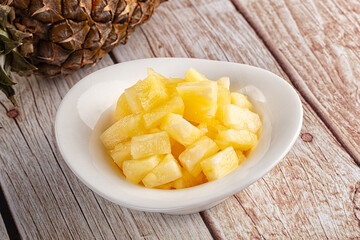 Sweet canned pineapple fruit pieces