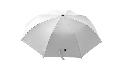 A top down view of a closed white umbrella with a black button on a black background in a studio shot