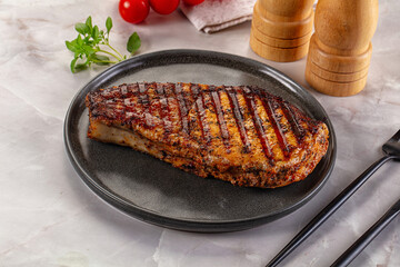 Grilled pork steak with bone