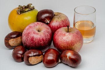 A composition of typically autumnal fruits such as chestnuts, persimmons or the Campanian Annurca apple, enhancing their beauty and detail.