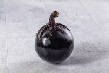 Raw round black big eggplant