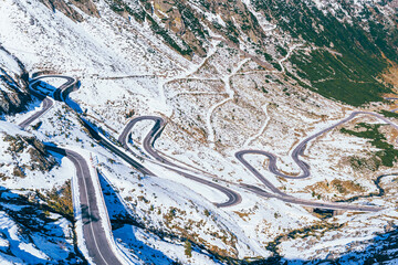 View of the Snow  Transfagarasan Highway Mountain Road in sunny day, Carpathians, Romania