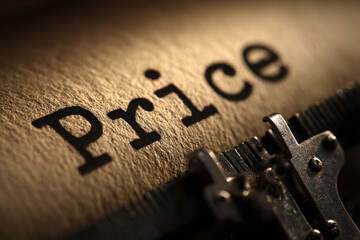 The word 'Price' typed on textured paper using an old vintage mechanical typewriter, symbolizing cost analysis.