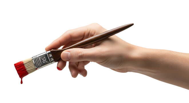 A hand holding a paintbrush with red paint dripping against a black background in a close up shot