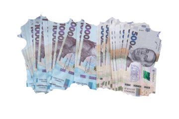 Stack of torn Ukrainian hryvnia banknotes, including 1000 and 500 bills, isolated on transparent background as a symbol of inflation.