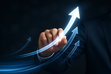 Business growth concept: businessman hand touching abstract glowing arrow showing success, progress, and financial increase on dark background