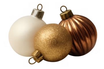 Three christmas baubles including white, gold, and bronze ornaments, symbolizing holiday season celebration and festive decoration
