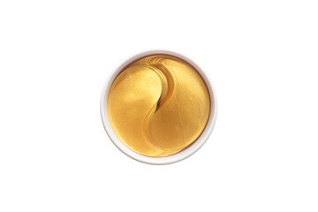 Gold hydrogel eye patches on white background.