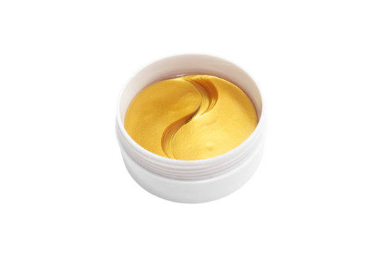 Gold hydrogel eye patches on white background.