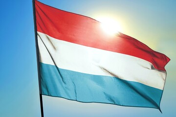 Luxembourg flag on sunny sky background