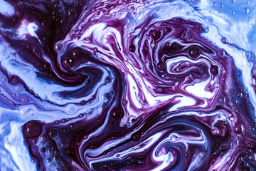 Macro photo of violet and blue swirling fluid creating marble-like texture. Ideal for posters, digital designs, cosmetic branding, and futuristic visuals. Abstract macro cool, aesthetic photo