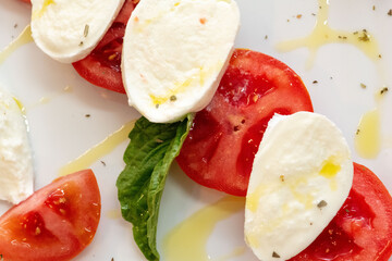 Gourmet appetizer platter with a variety of Italian antipasti beautifully arranged on a wooden board