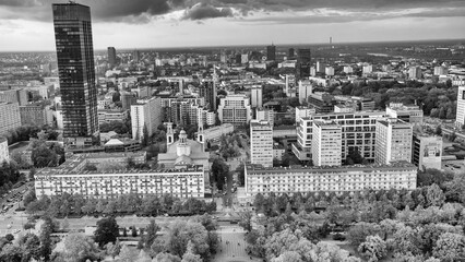 Aerial daytime view of Warsaw city showcasing modern skyscrapers and urban streets