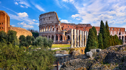 Rome, Italy. Roman Colosseum (Coliseum or Colosseo) Ancient Ruins of Flavian Amphitheatre. Arena for Gladiator Fightings. World Famous Landmark and Very Popular Touristic Destination Vacation Trip.