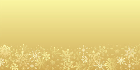 New year and Christmas golden background with snowflakes. Copy space frame. Shiny luxury winter backdrop for greeting card, banner, packaging design. Glowing holiday border with gold ice crystals.
