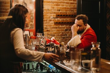 Tired santa claus experiencing holiday burnout at bar
