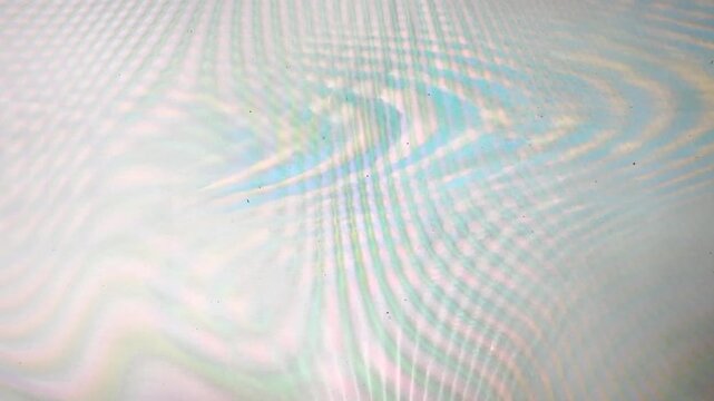 colorful interference pattern with wavy lines and soft rainbow hues. The image features moir&eacute;-like optical effects and a subtle gradient texture, creating a futuristic and digital aesthetic.