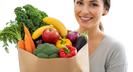 Smiling woman holding paper bag full of fresh healthy groceries and vegetables transparent background