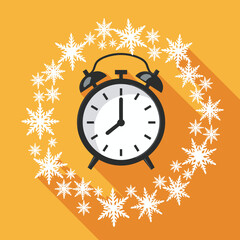 Alarm clock surrounded by snowflakes on orange background  