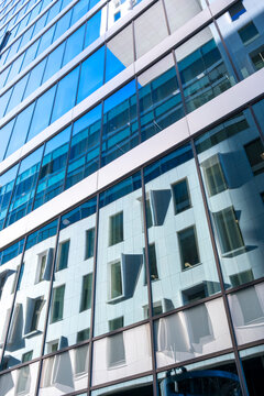 Contemporary urban architecture facade with geometry minimal symmetry and structure pattern and design under daylight showing aesthetic clarity and balance in modern perspective