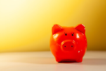 Piggy bank on yellow background, saving money for the future