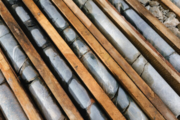 Mining geology exploration of minerals after drilling. Core samples in geological laboratory.