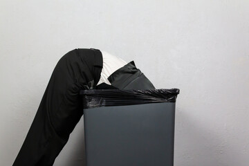Washed Up Businessman Tossed into Garbage Can. Concept of Being Sacked or Fired. Stock Market Crash.