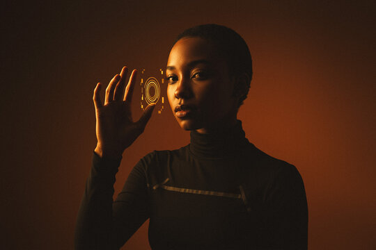 Futuristic woman interacting with digital hologram, innovation and technology concept