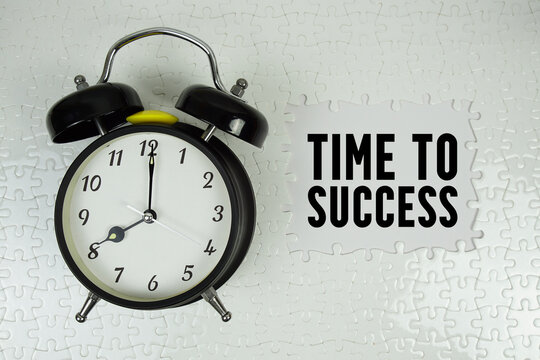 Time To Success text with alarm clock on white background - Powered by Adobe