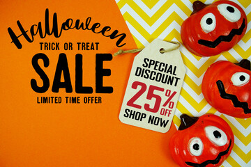 Halloween sale graphic featuring goofy pumpkins, bold text, and a hanging tag offering 25% off. Bright orange and yellow background