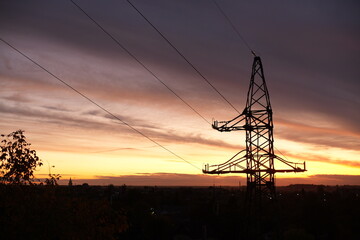 high voltage power lines at sunset