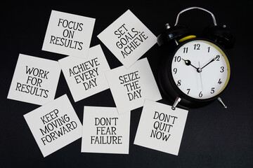 Alarm Clock Surrounded with Message about Goals Concept