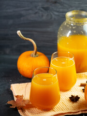 Glasses of pumpkin juice. Homemade drink prepared in a jar.