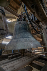 Obraz premium Blois, France - 10 27 2025: Detail view of one of the 48 bells in the bell tower of the Basilica of Our Lady of the Trinity