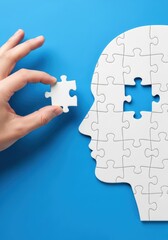 The hand inserts the last piece of the puzzle into the head, symbolizing a complete thought and clear understanding
