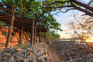 Wooden structure is built on a rocky shoreline