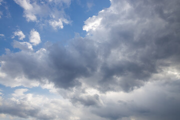 The sky is cloudy and the sun is shining through the clouds