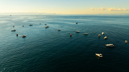 Fishing boats on the Bosphorus in Istanbul, Turkey on a bright day.