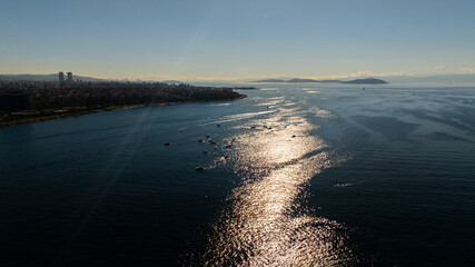 Fishing boats on the Bosphorus in Istanbul, Turkey on a bright day.