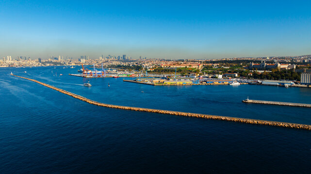 View of Kadikoy, the Kadikoy pier and the Kadikoy breakwater with the historic Haydarpasa station in renovation, towards the European side of Istanbul, seen from the Princes' Island ferry on the way b