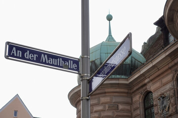 Street Sign An der Mauthalle With Former Customs House In Nuremberg, Germany. 