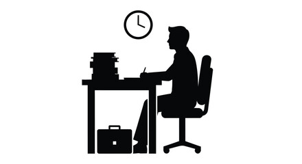 A focused professional working late at a desk striking silhouette