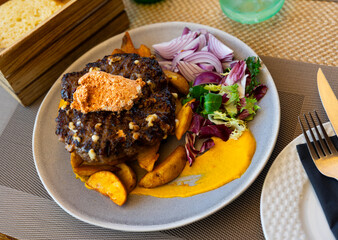 Traditional Macedonian dish pleskavica, which has become popular strip food in central Europe. Pleskavitsa is chopped cutlet cooked on grill.