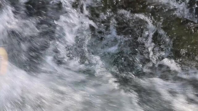 The Zelnytsia river cascades over rocky cliffs, creating splashes and mist. Water sounds emphasize the grandeur of nature.