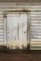 Old weathered white door